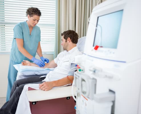 Nurse Injecting Patient For Renal Dialysis Treatment | Remington Medical