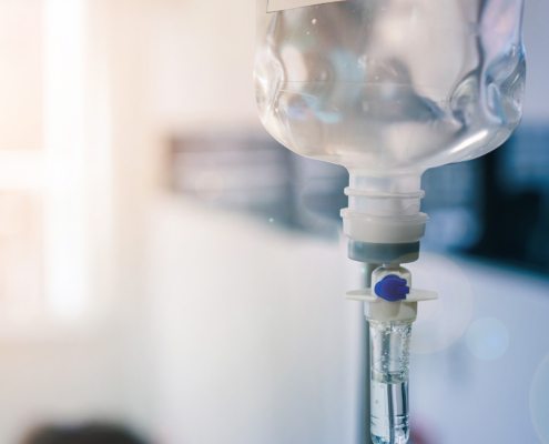 Close up of medical drip or IV drip chamber