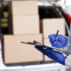 Close up of man in protective suit checking delivery in list